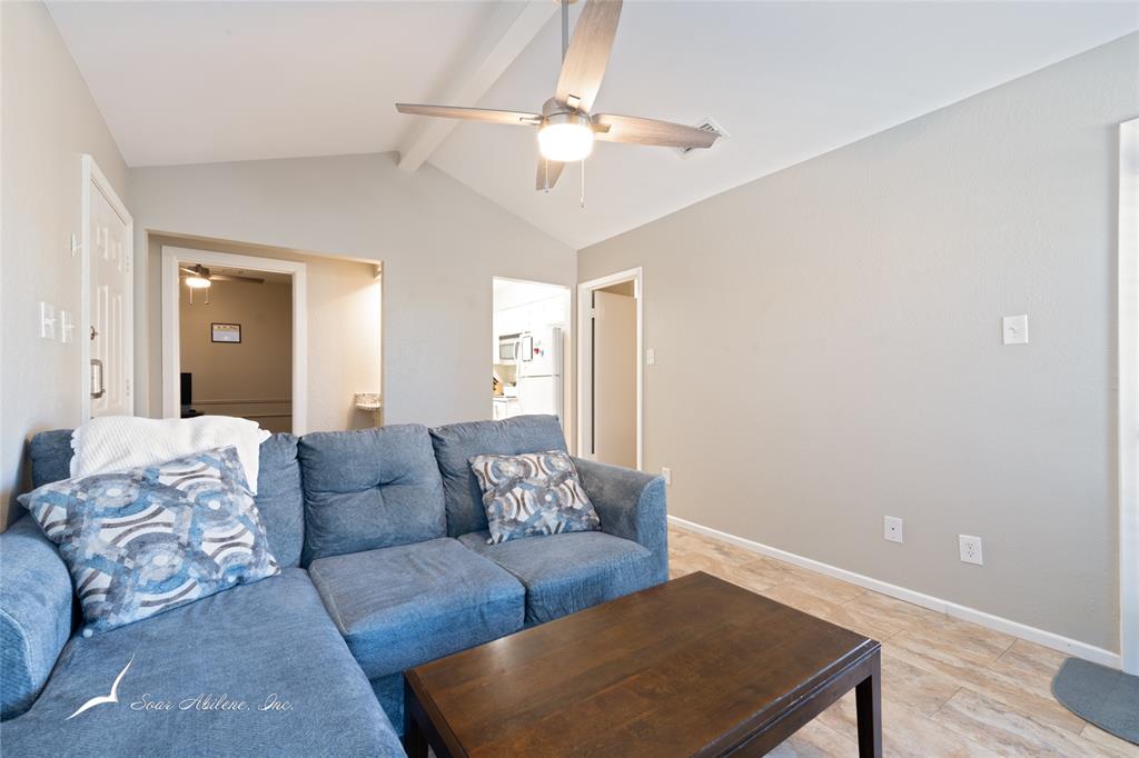 1318 Westheimer Road, Unit 217 Abilene, TX 79601 - Photo 5 of 16 a living room with furniture and a window