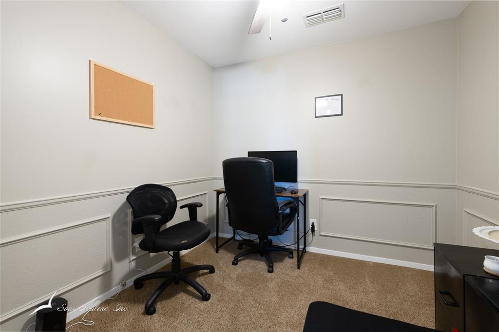1318 Westheimer Road, Unit 217 Abilene, TX 79601 - Photo 7 of 16 a view of a workspace with furniture