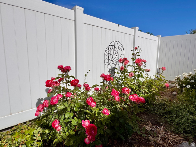 461 Topaz Boulevard, Unit 6 Delta, UT 84624 - Photo 36 of 45 Landscaped garden bed featuring vibrant red roses