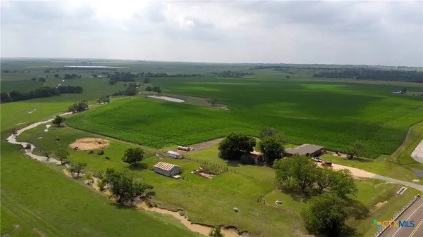 an aerial view of a houses with outdoor space and street view