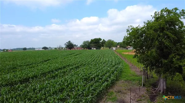 a view of a lake with green space
