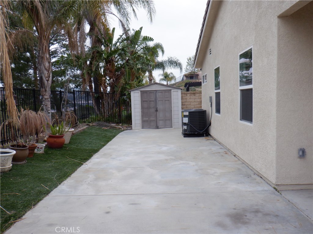 28348 Milbrook Place Castaic, CA 91384 - Photo 11 of 17 a view of a house with a yard and a large tree