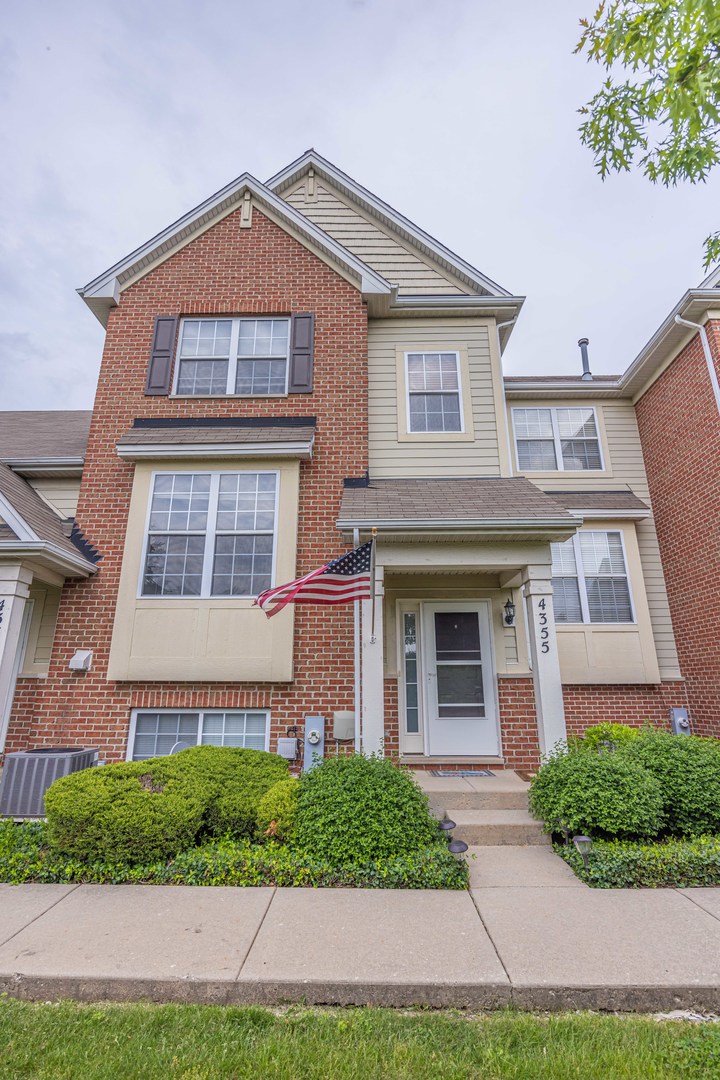 4355 Timber Ridge Court Joliet, IL 60431 - Photo 1 of 24 a front view of a house with garden