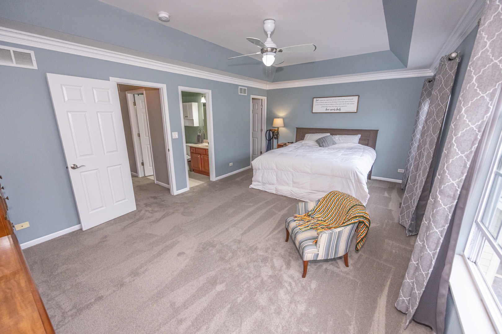 4355 Timber Ridge Court Joliet, IL 60431 - Photo 13 of 24 a bedroom with a bed and a large window