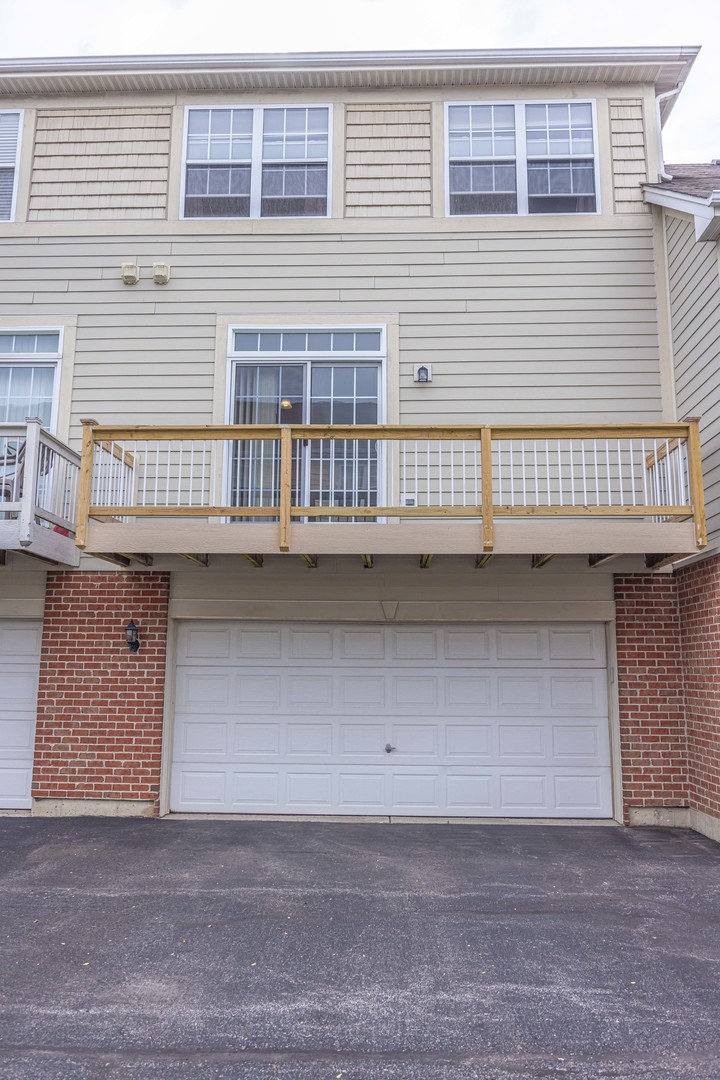 4355 Timber Ridge Court Joliet, IL 60431 - Photo 24 of 24 a front view of a house with garage