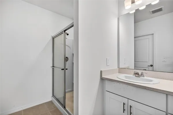 a bathroom with a sink and mirror