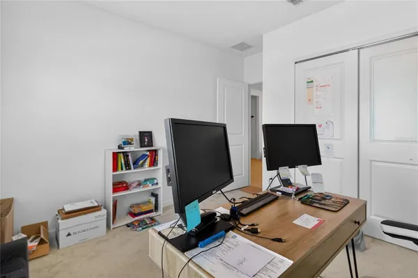 a view of a workspace with furniture
