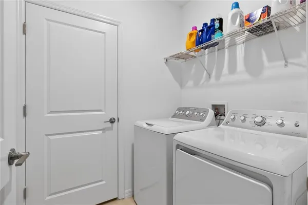 a utility room with dryer and washer