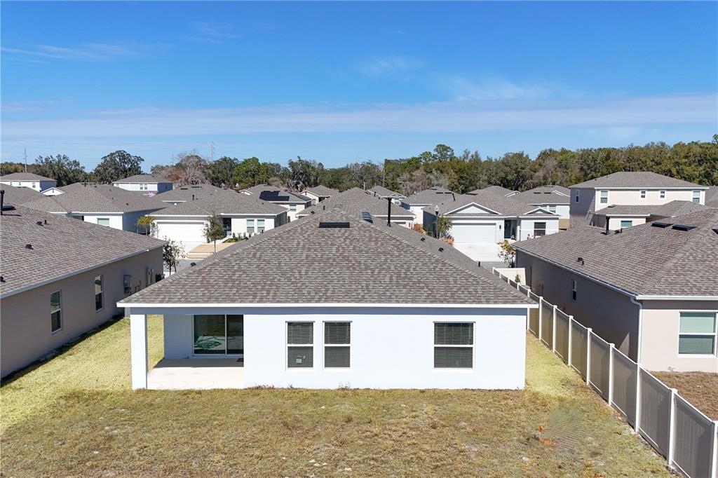 9633 Rampart Road Leesburg, FL 34788 - Photo 26 of 34 an aerial view of a house with a yard