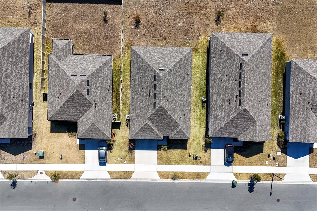 9633 Rampart Road Leesburg, FL 34788 - Photo 32 of 34 an aerial view of houses with outdoor space