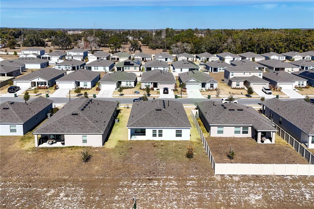 9633 Rampart Road Leesburg, FL 34788 - Photo 33 of 34 an aerial view of residential houses with city view