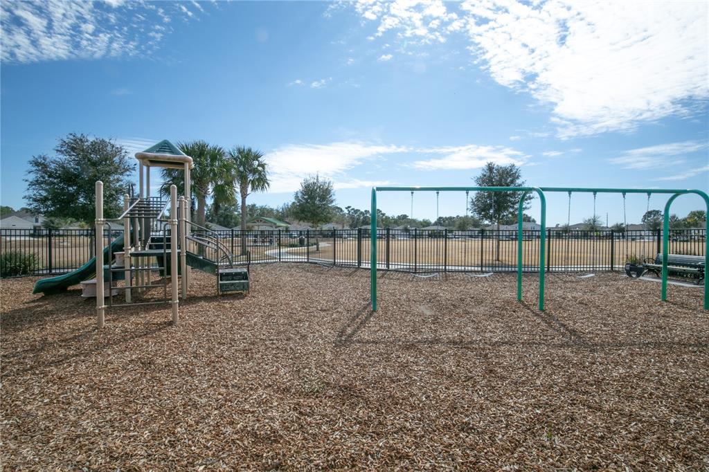9633 Rampart Road Leesburg, FL 34788 - Photo 34 of 34 a view of outdoor space with deck and trees