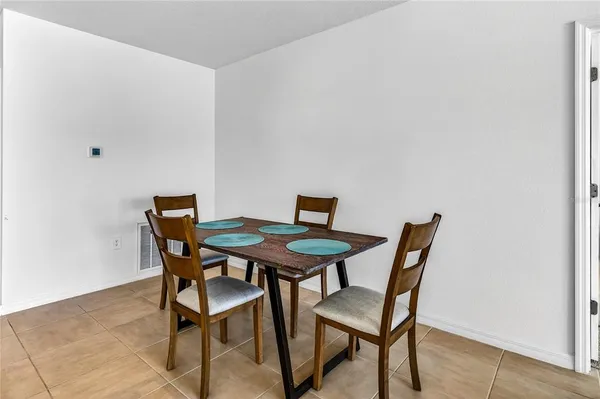 a view of a dining room with furniture and a wooden floor