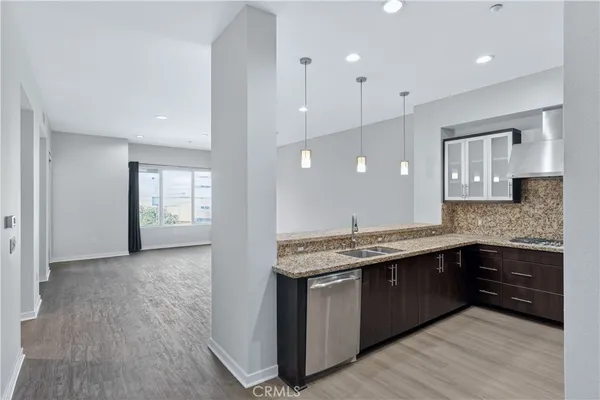a kitchen with a sink and cabinets