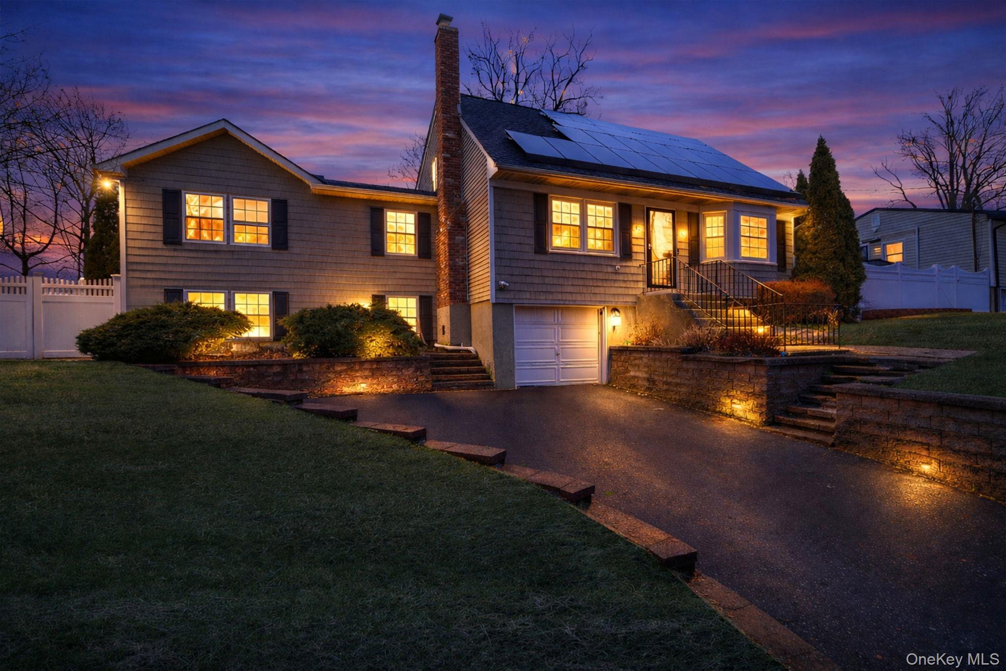 a view of a house with roof deck