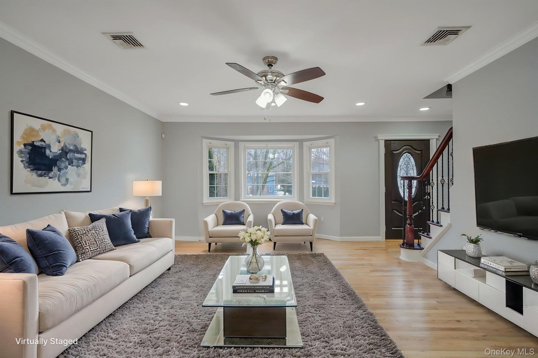 92 Hawthorne Road Kings Park, NY 11754 - Photo 12 of 33 a living room with furniture and a flat screen tv