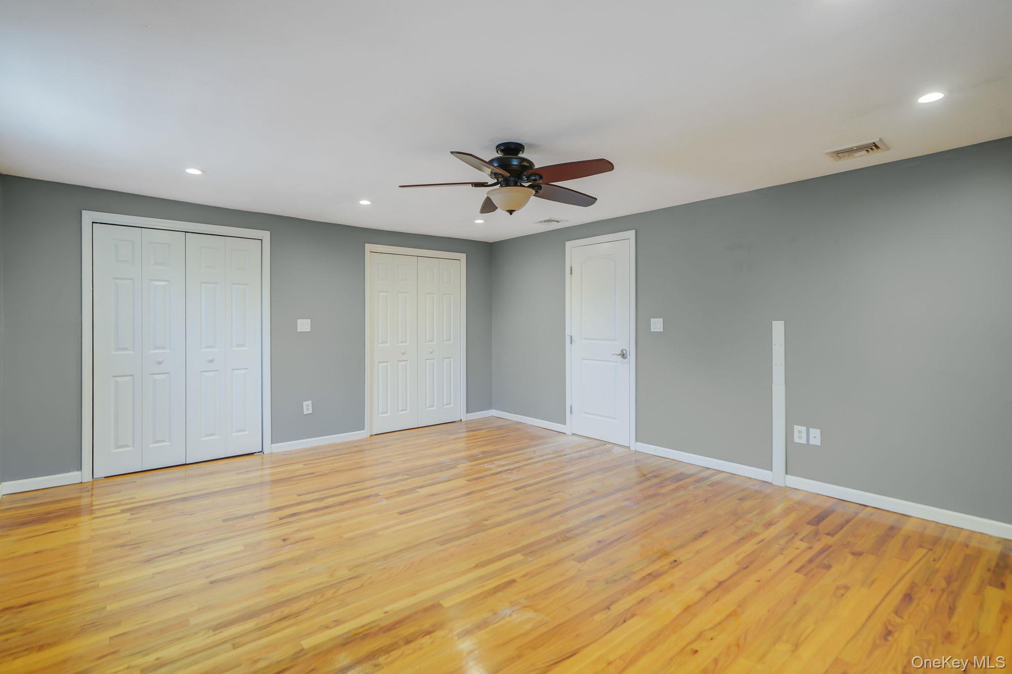 92 Hawthorne Road Kings Park, NY 11754 - Photo 18 of 33 a view of empty room with wooden floor