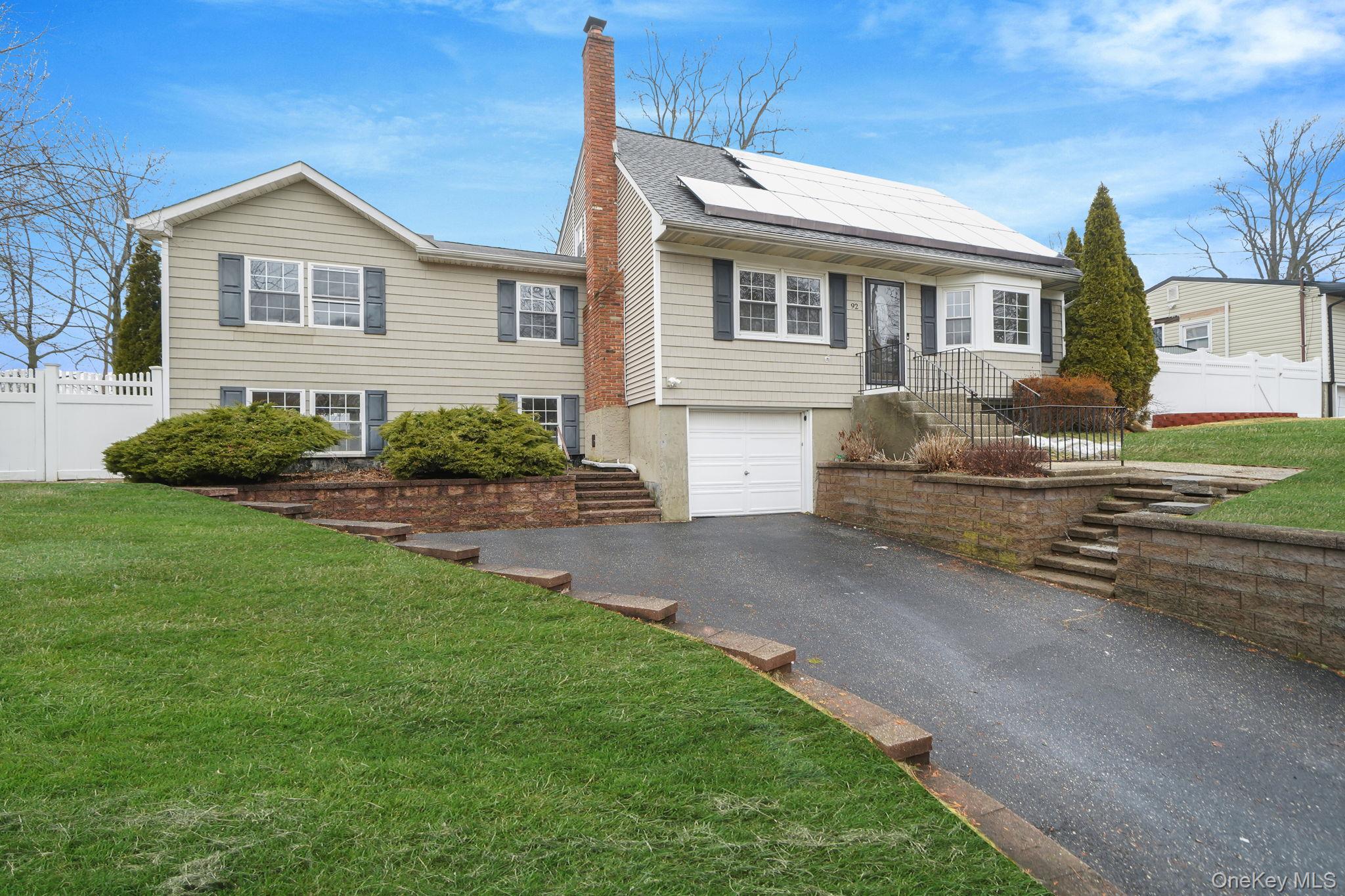 92 Hawthorne Road Kings Park, NY 11754 - Photo 2 of 33 a view of a yard in front of a house