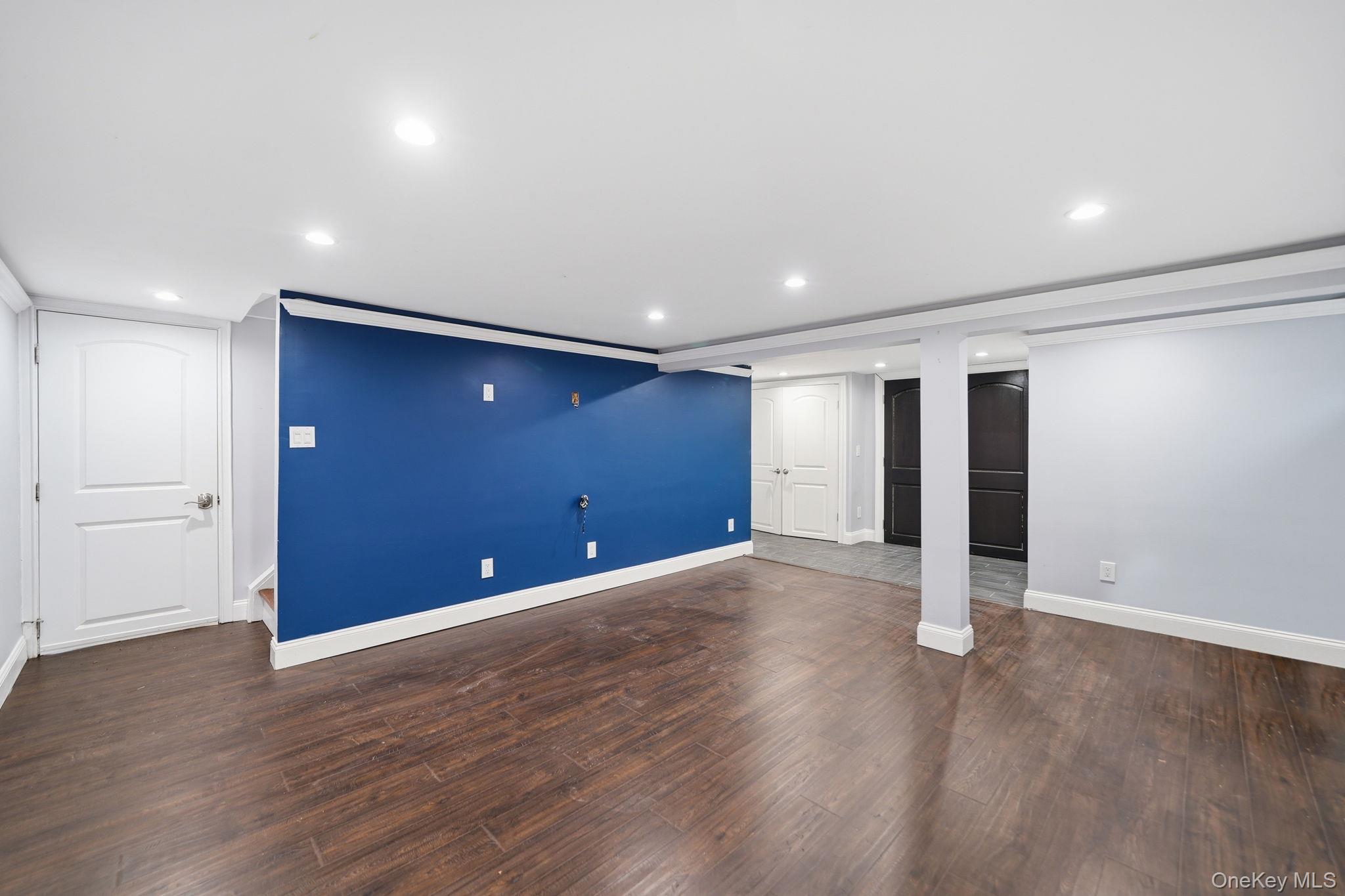 92 Hawthorne Road Kings Park, NY 11754 - Photo 22 of 33 a view of an empty room with wooden floor