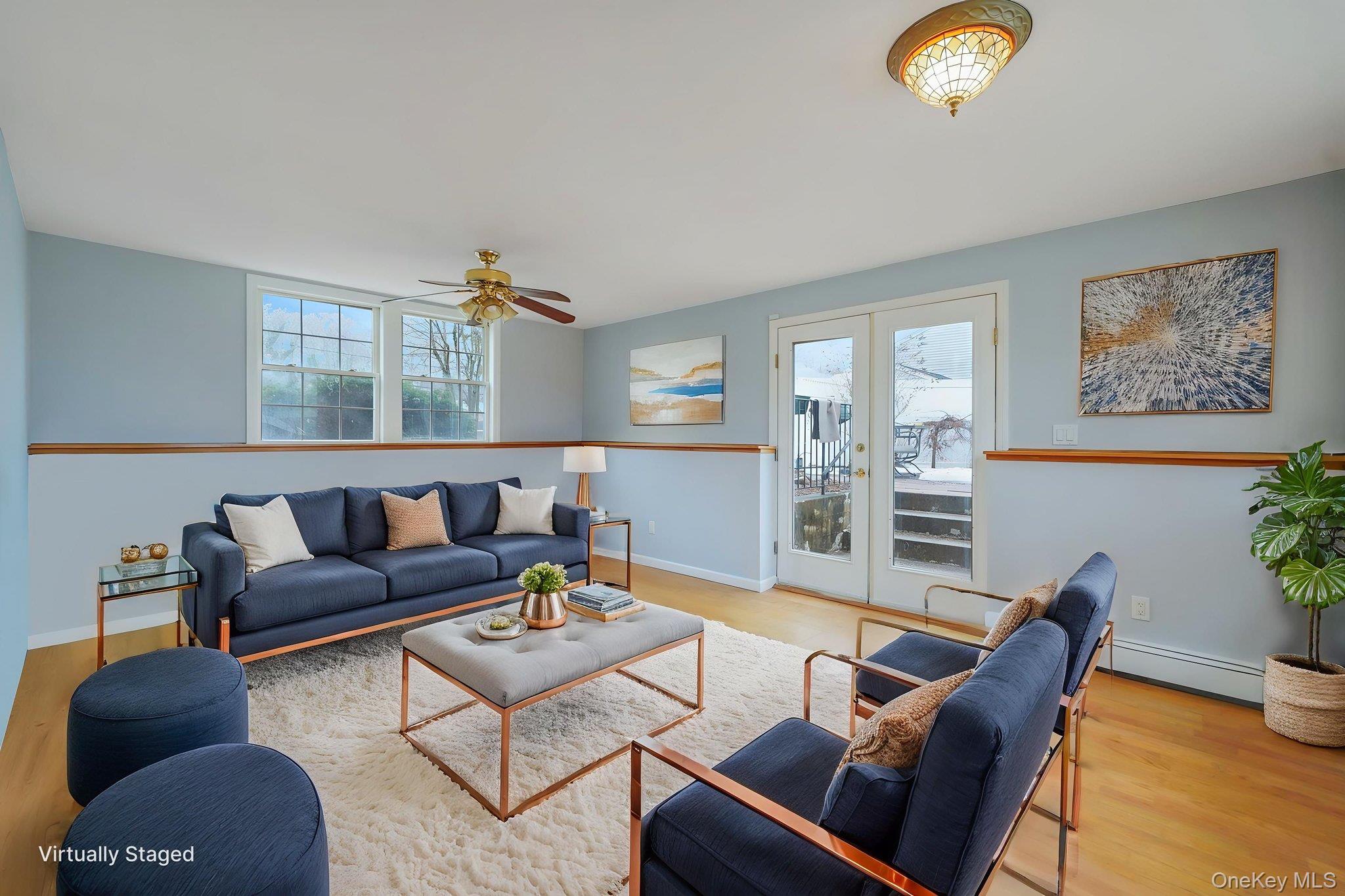 92 Hawthorne Road Kings Park, NY 11754 - Photo 26 of 33 a living room with furniture and a large window