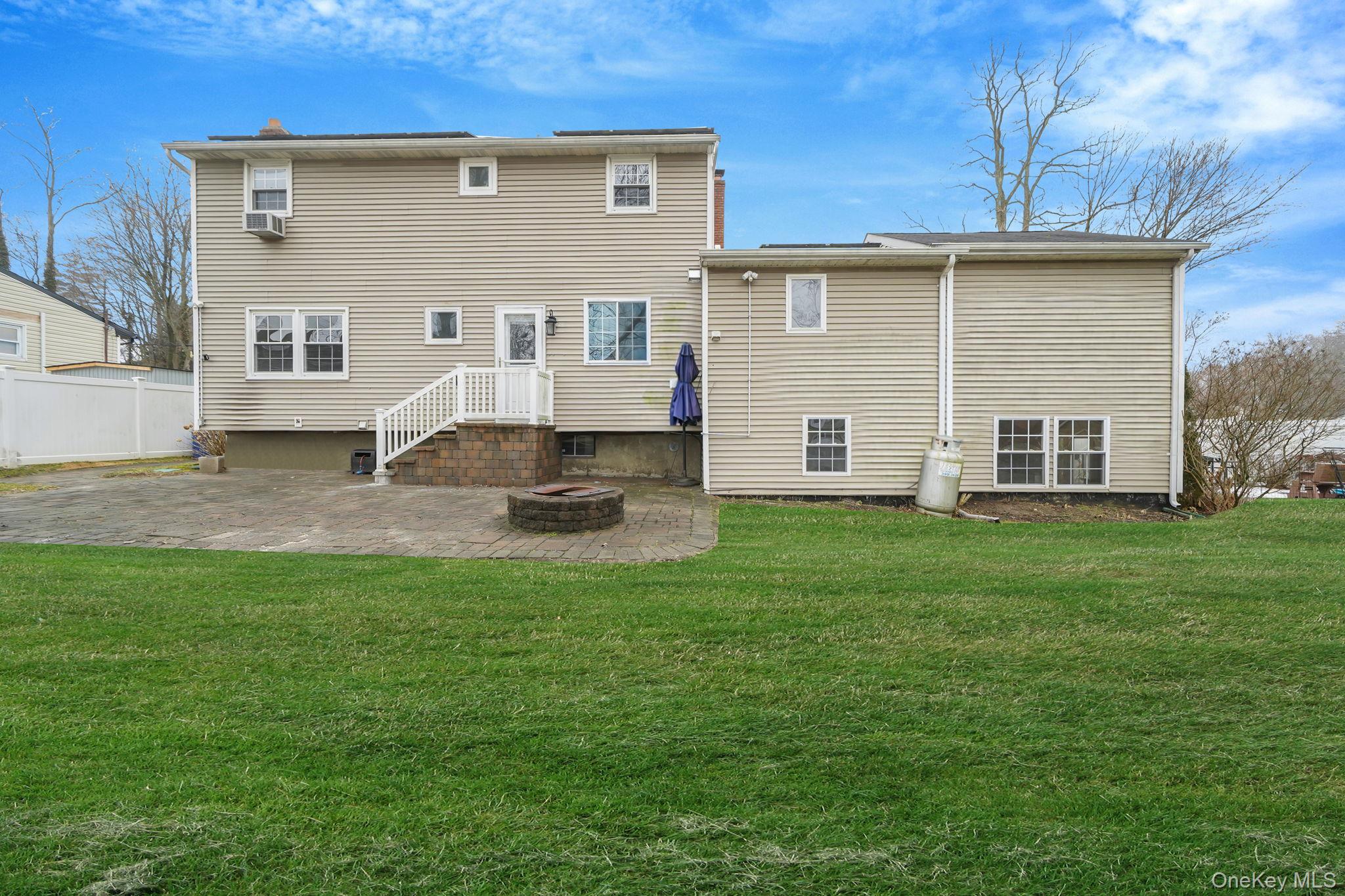92 Hawthorne Road Kings Park, NY 11754 - Photo 29 of 33 a view of a house with a backyard