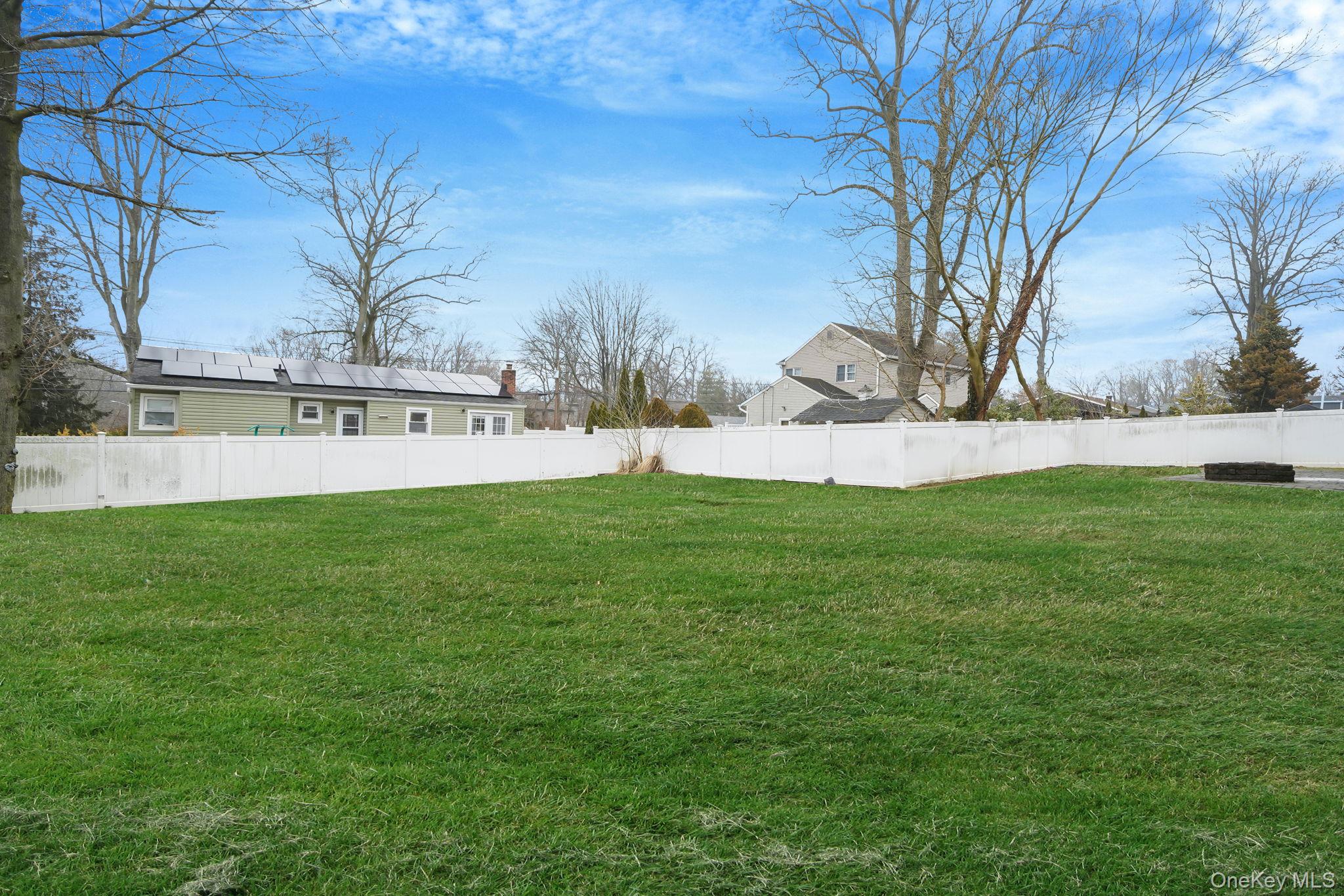92 Hawthorne Road Kings Park, NY 11754 - Photo 30 of 33 a view of yard with swimming pool and green space