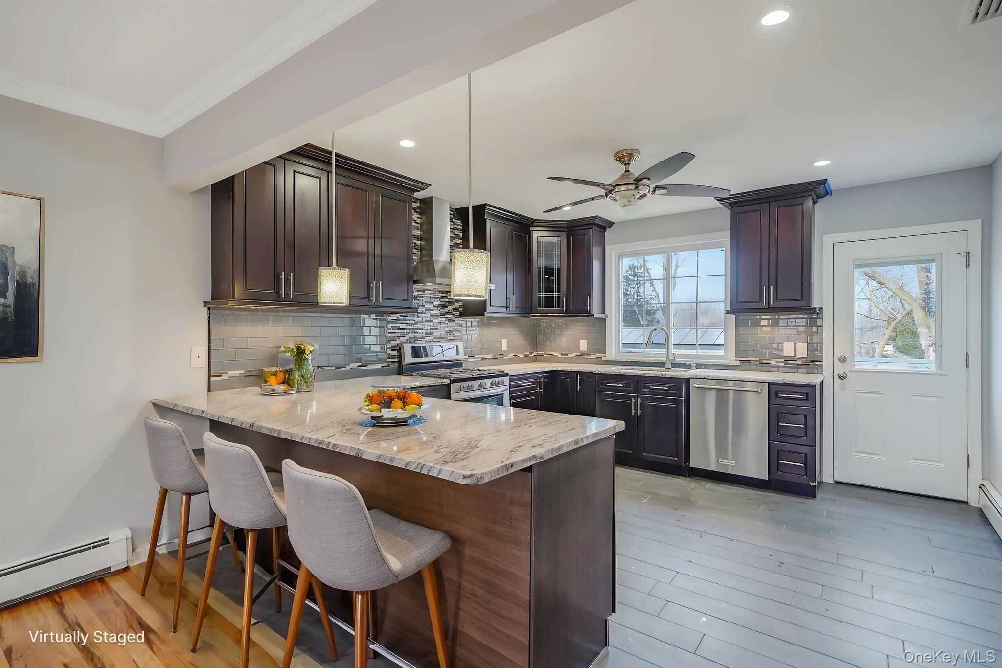 92 Hawthorne Road Kings Park, NY 11754 - Photo 4 of 33 a kitchen with granite countertop a sink stove and refrigerator