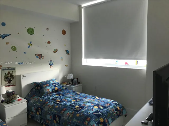 a bathroom with a shower and a toilet