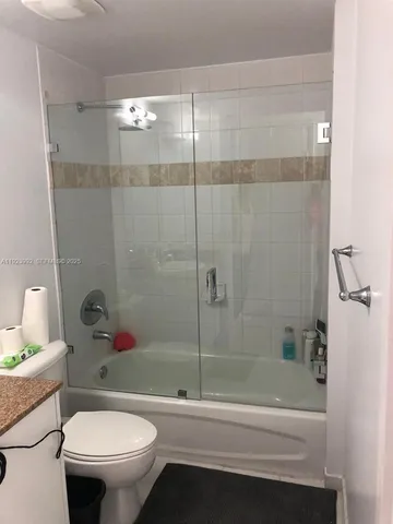 view of room with window and stairs