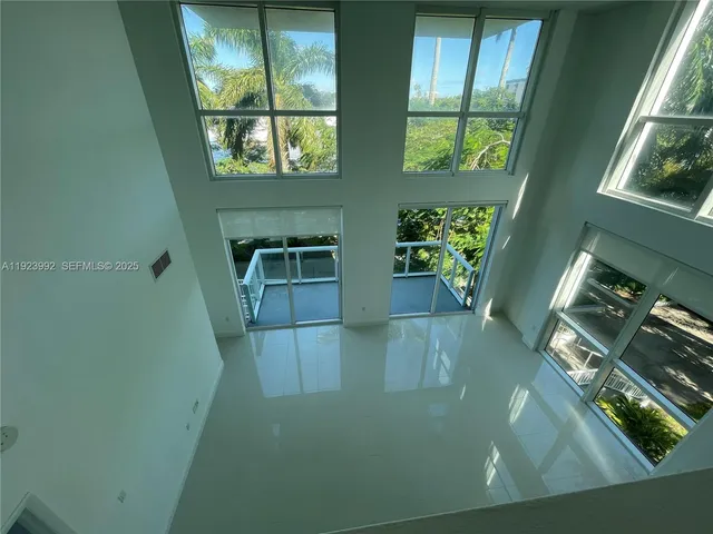 a view of room with window and stairs