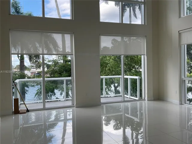 a view of a glass door with a balcony