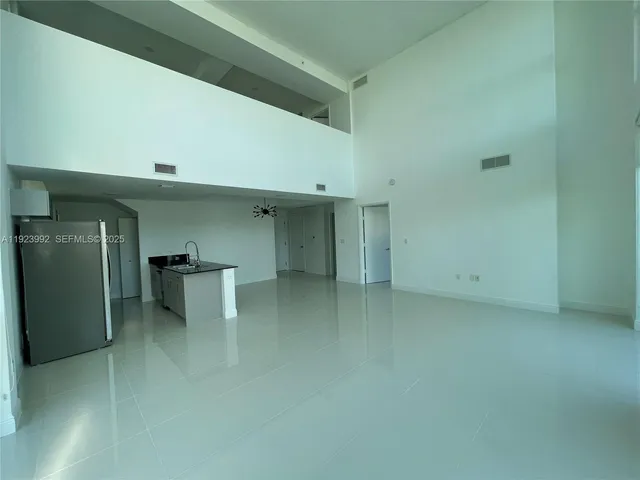 a bathroom with a granite countertop sink a toilet a mirror and shower