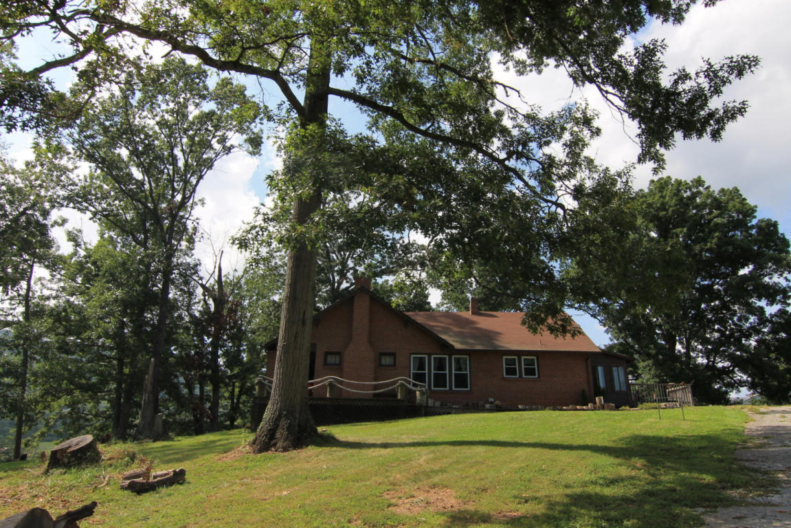 4324 Rakes Road Roanoke, VA 24014 - Photo 1 of 38 a front view of a house with a yard
