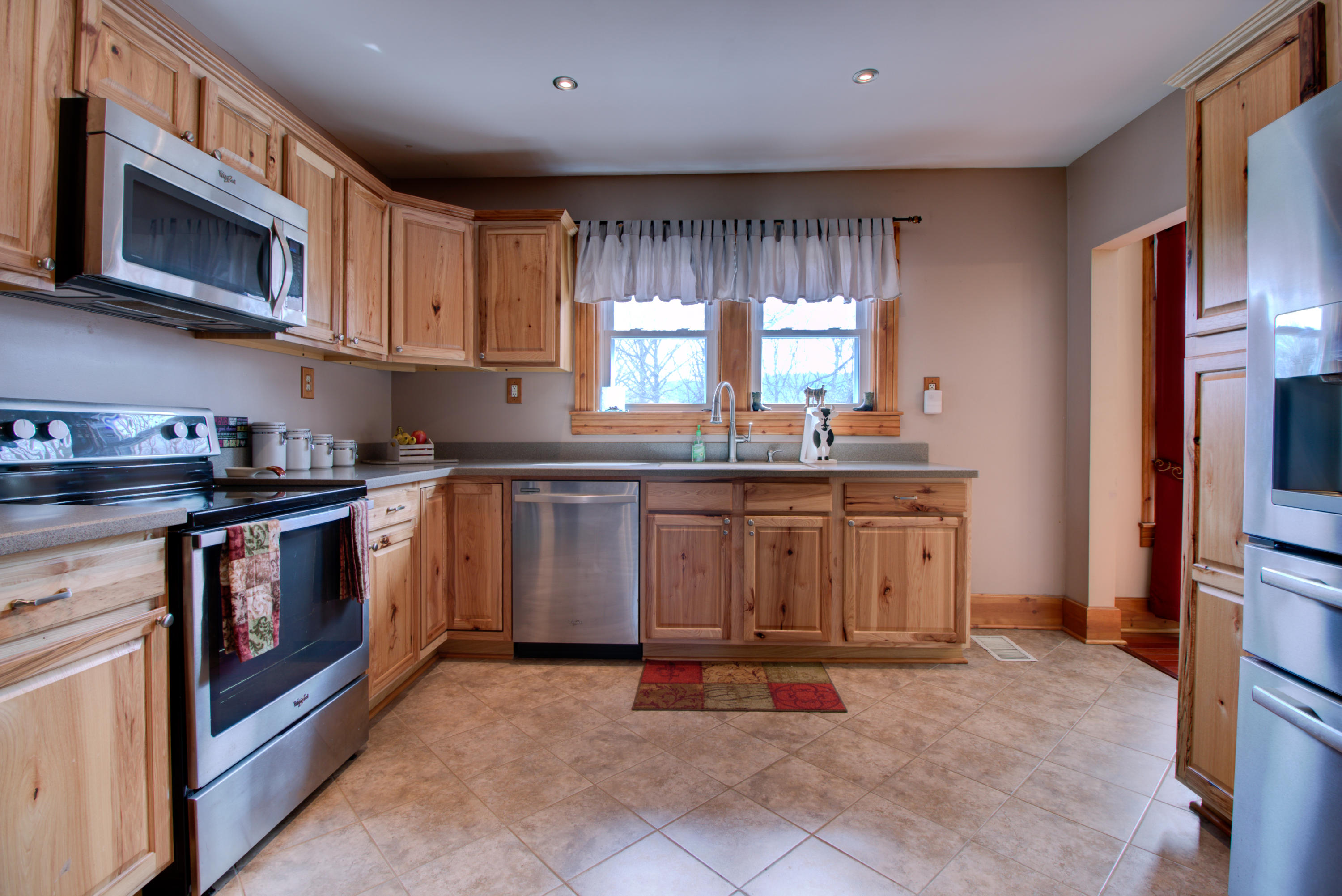 4324 Rakes Road Roanoke, VA 24014 - Photo 2 of 38 a kitchen with stainless steel appliances granite countertop a stove a sink dishwasher and a microwave oven with cabinets