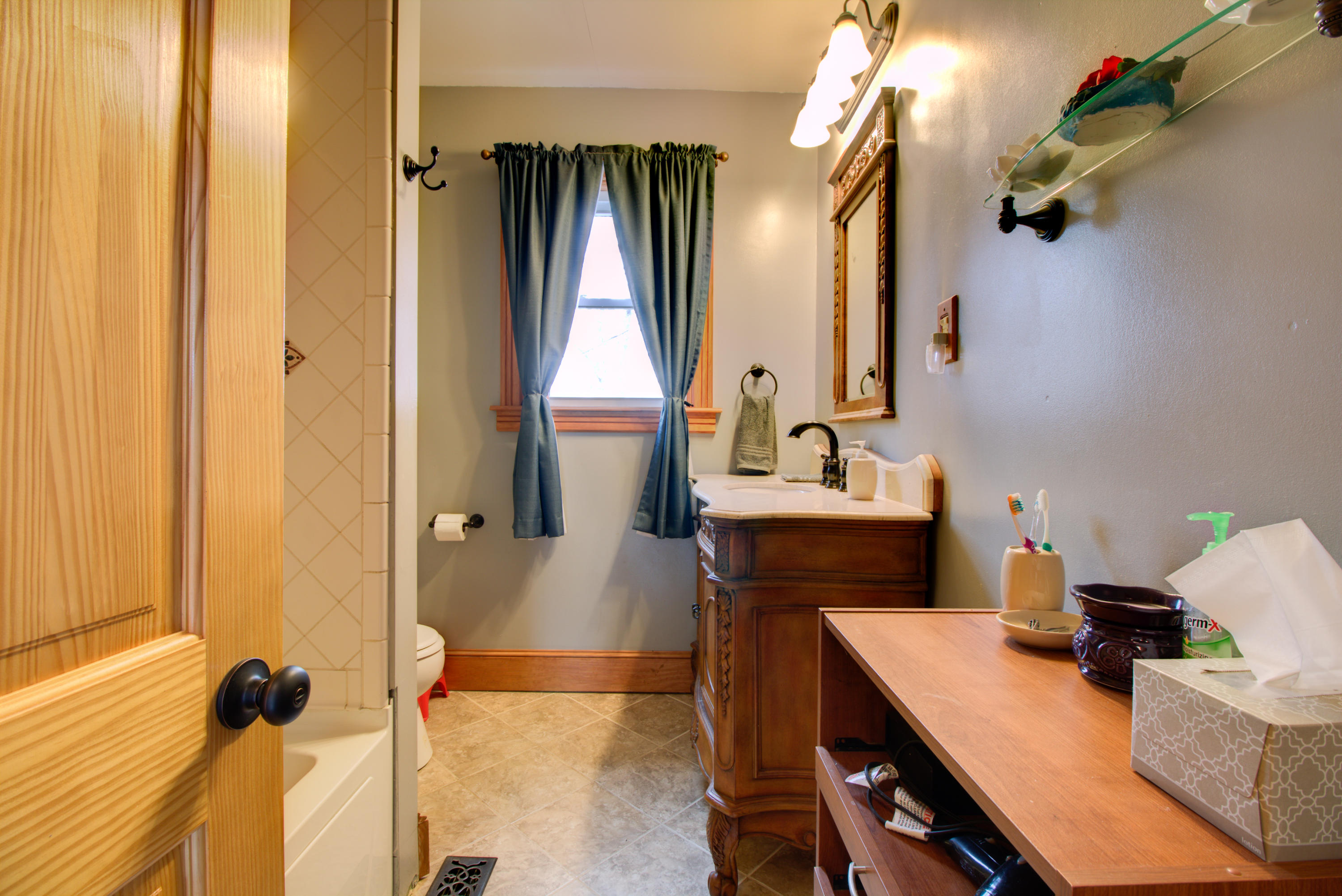 4324 Rakes Road Roanoke, VA 24014 - Photo 13 of 38 a bathroom with a sink and a mirror