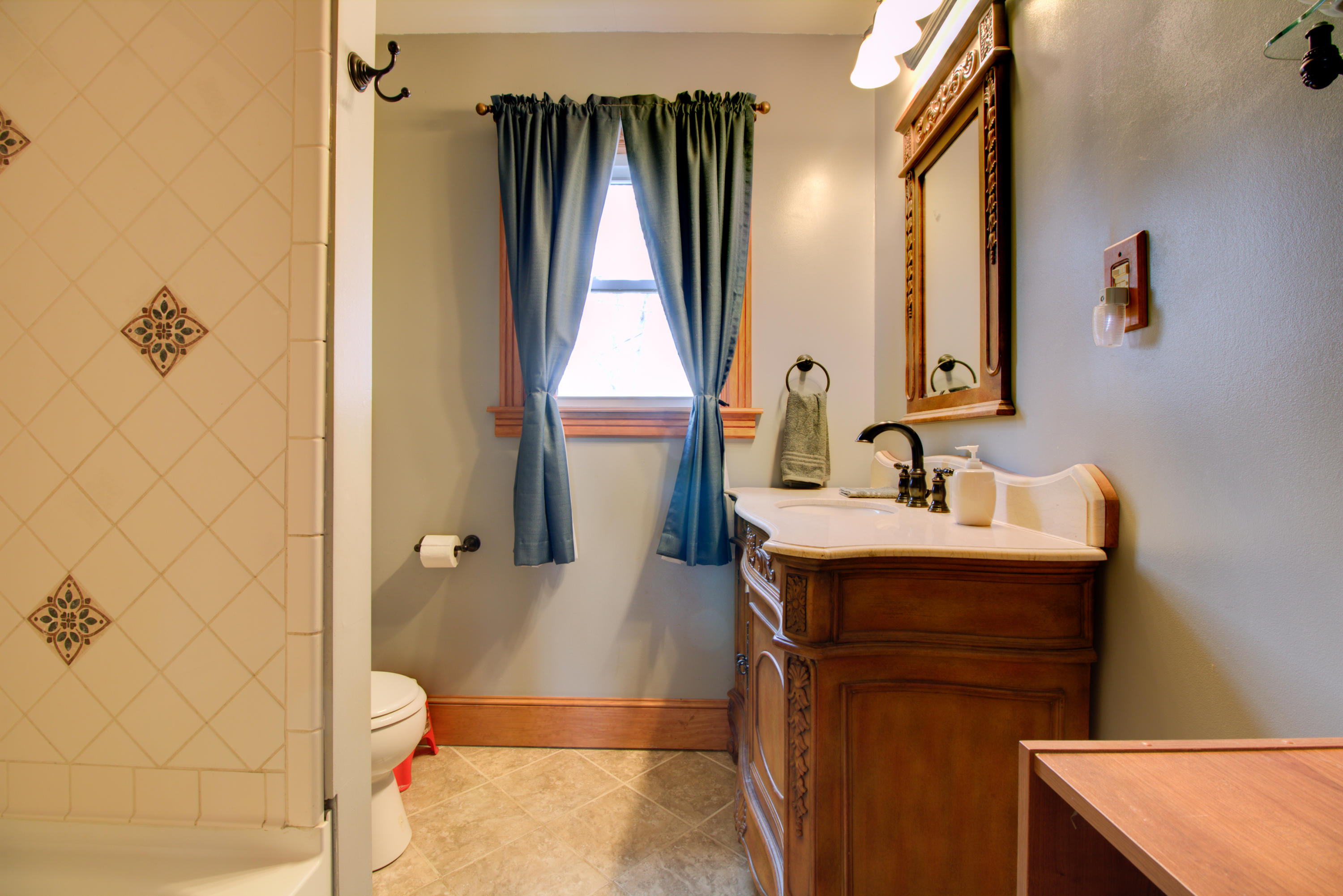 4324 Rakes Road Roanoke, VA 24014 - Photo 14 of 38 a bathroom with a sink and mirror with toilet