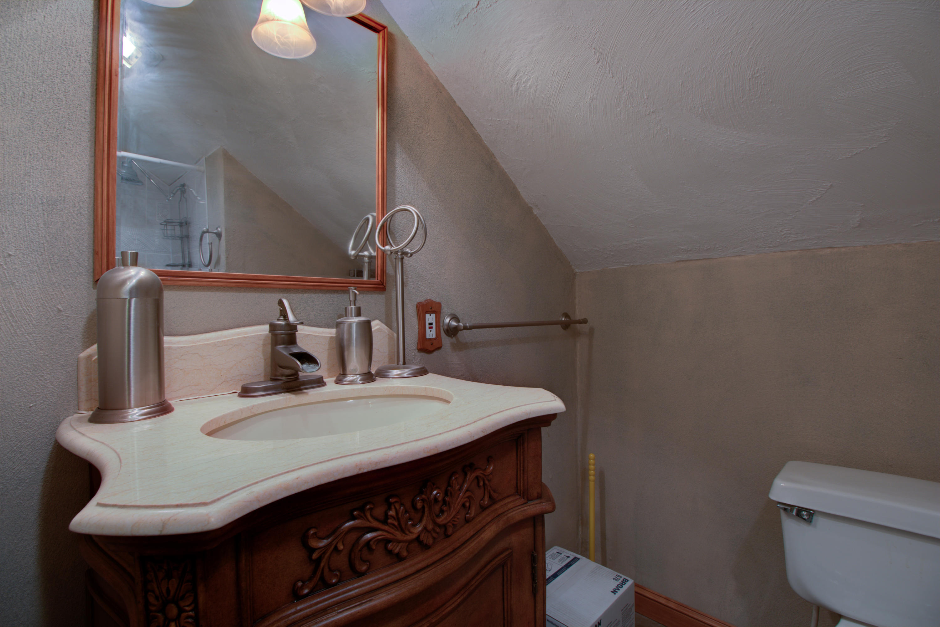 4324 Rakes Road Roanoke, VA 24014 - Photo 25 of 38 a bathroom with a sink a toilet and mirror