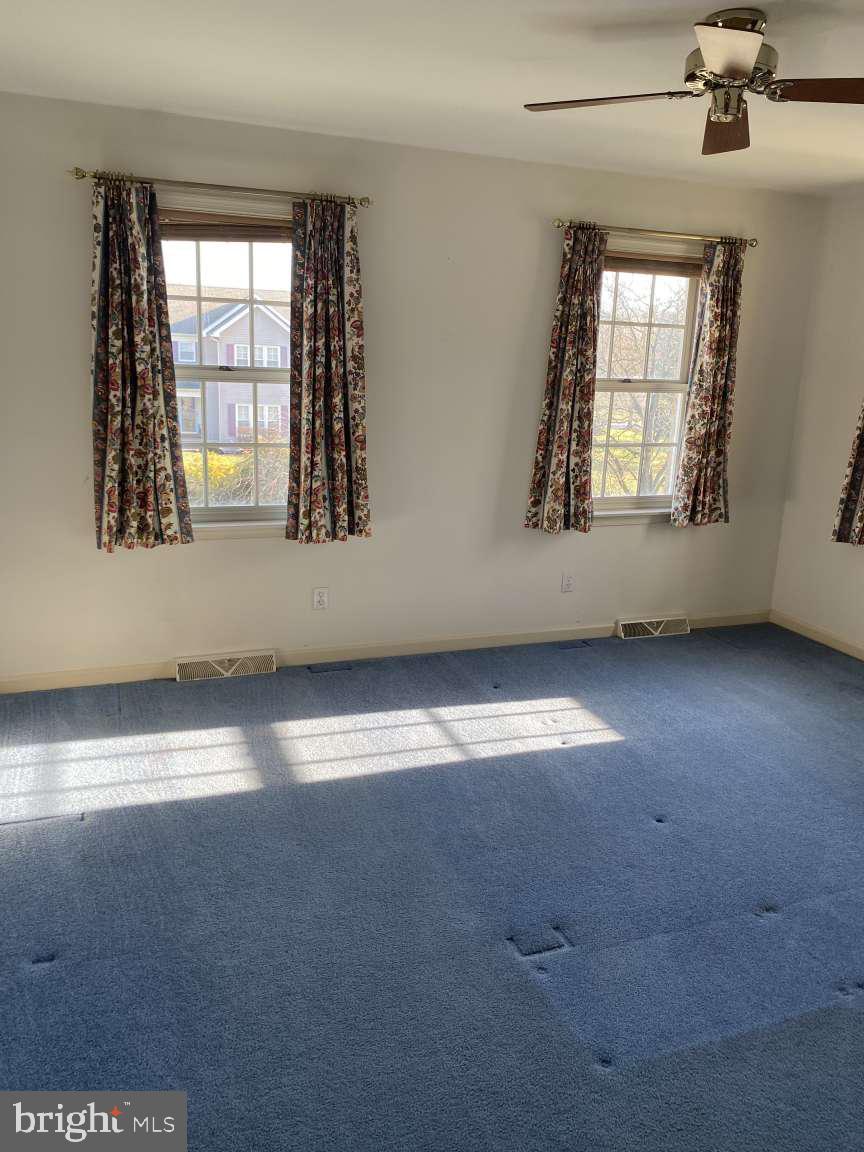 1837 Downing Street York, PA 17408 - Photo 18 of 21 an empty room with wooden floor and windows