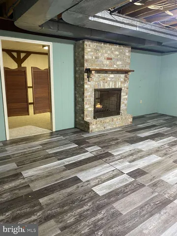 a view of empty room with a fireplace