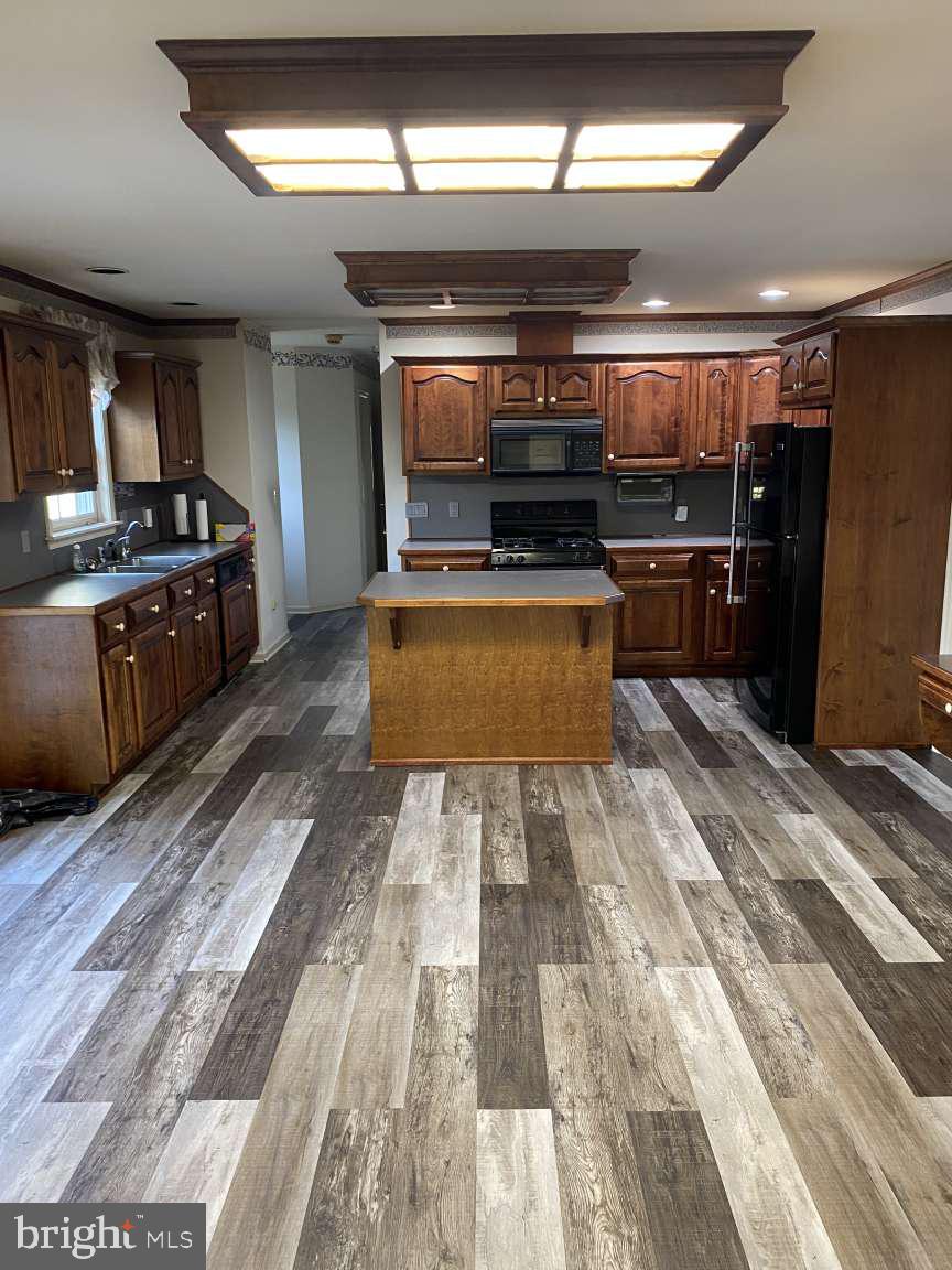 1837 Downing Street York, PA 17408 - Photo 7 of 21 a large kitchen with stainless steel appliances kitchen island granite countertop a sink counter space and stainless steel appliances