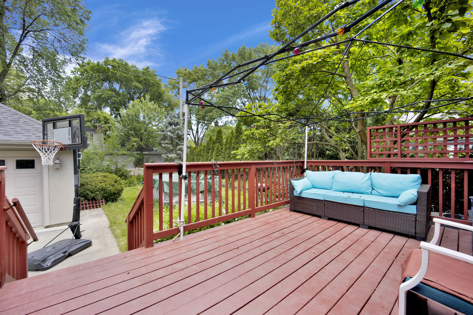 2310 Illinois Road Northbrook, IL 60062 - Photo 35 of 41 a view of a deck with couches wooden floor and fence
