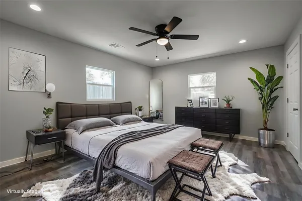 a bed room with a bed and a chandelier