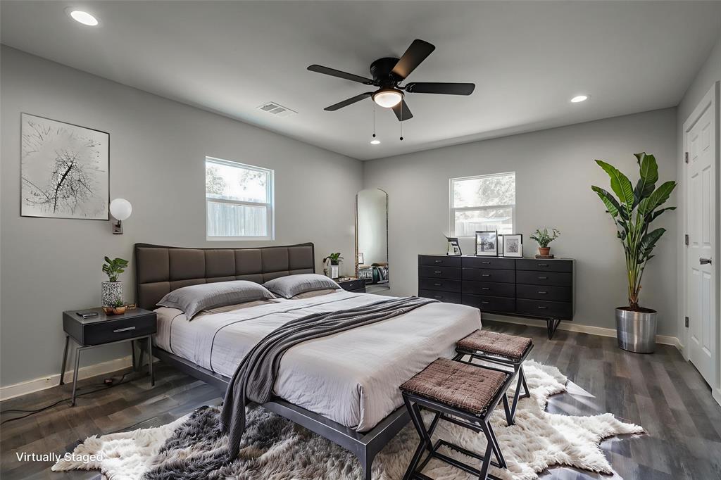 304 Pine Street Seven Points, TX 75143 - Photo 20 of 38 a bed room with a bed and a chandelier