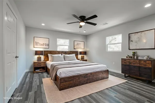 a bedroom with a bed and a dresser