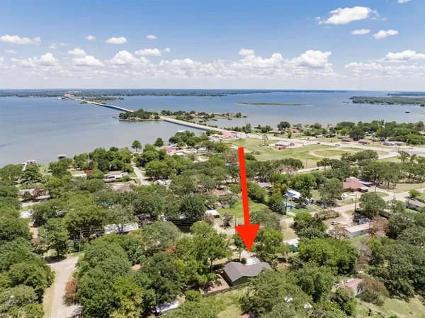 an aerial view of a houses with outdoor space