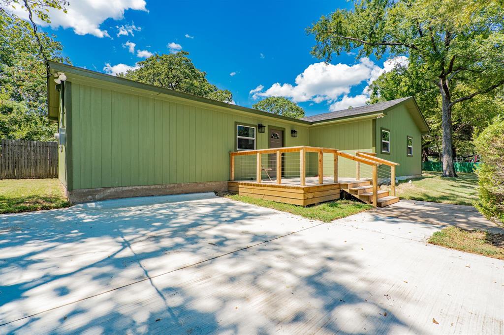 304 Pine Street Seven Points, TX 75143 - Photo 6 of 38 a house view with a backyard space