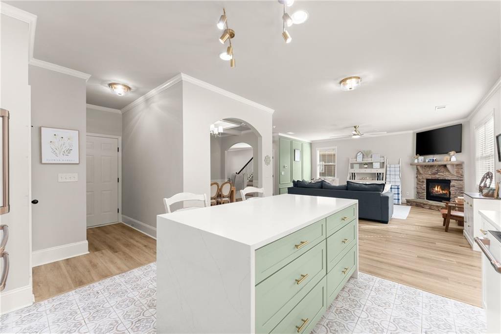 6667 Rivergreen Road Flowery Branch, GA 30542 - Photo 17 of 50 a view of living room kitchen sink and wooden floor