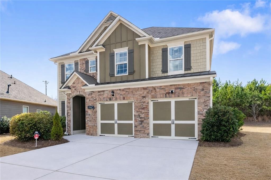 6667 Rivergreen Road Flowery Branch, GA 30542 - Photo 2 of 50 a front view of a house with a yard