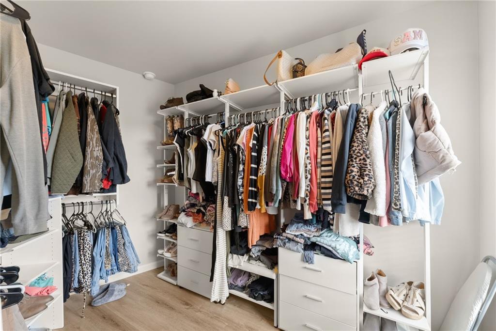 6667 Rivergreen Road Flowery Branch, GA 30542 - Photo 24 of 50 a view of walk in closet with clothes