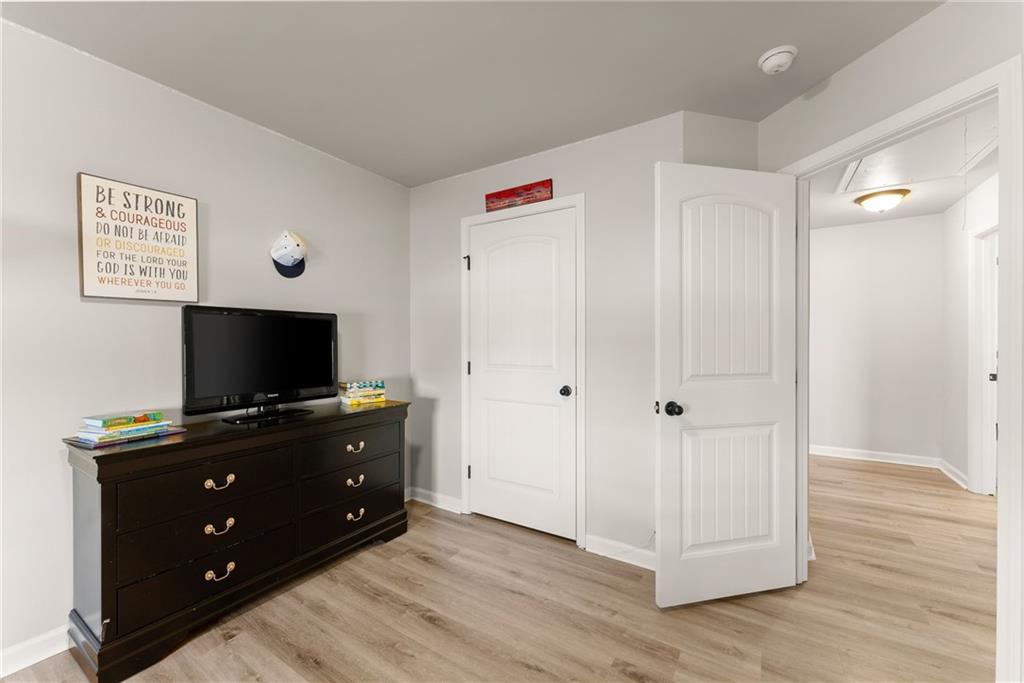 6667 Rivergreen Road Flowery Branch, GA 30542 - Photo 33 of 50 a living room with furniture and flat screen tv